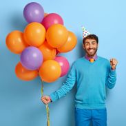 birthday-party-concept-positive-man-clenches-fists-with-happiness_2736
